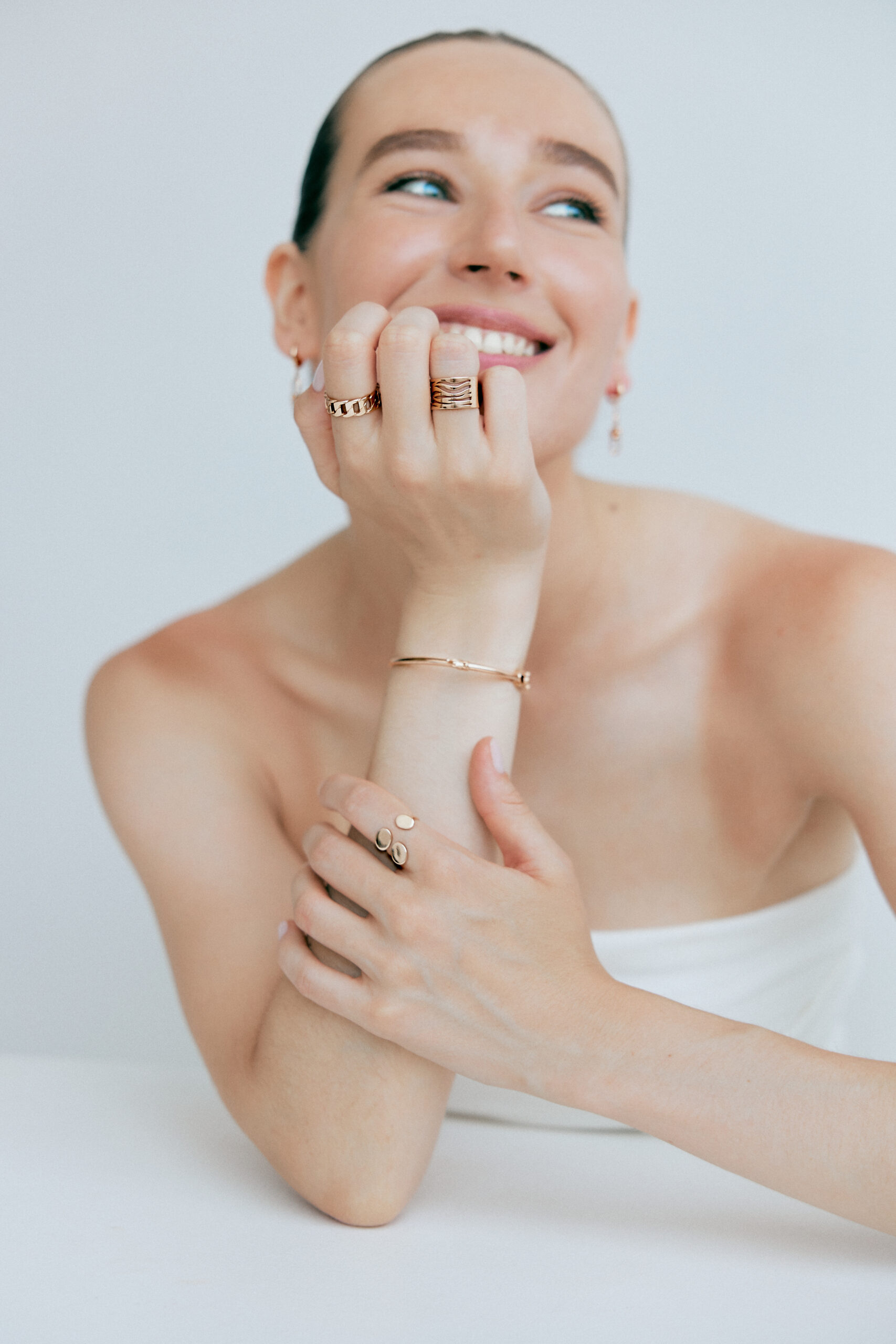 Lifestyle portrait wearing ZODI rings and bracelet